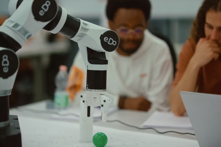 Picture: MDT students testing the programming of the robot arm