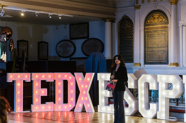 Picture: Anita giving a welcome speech at the TEDxESCPLondon event